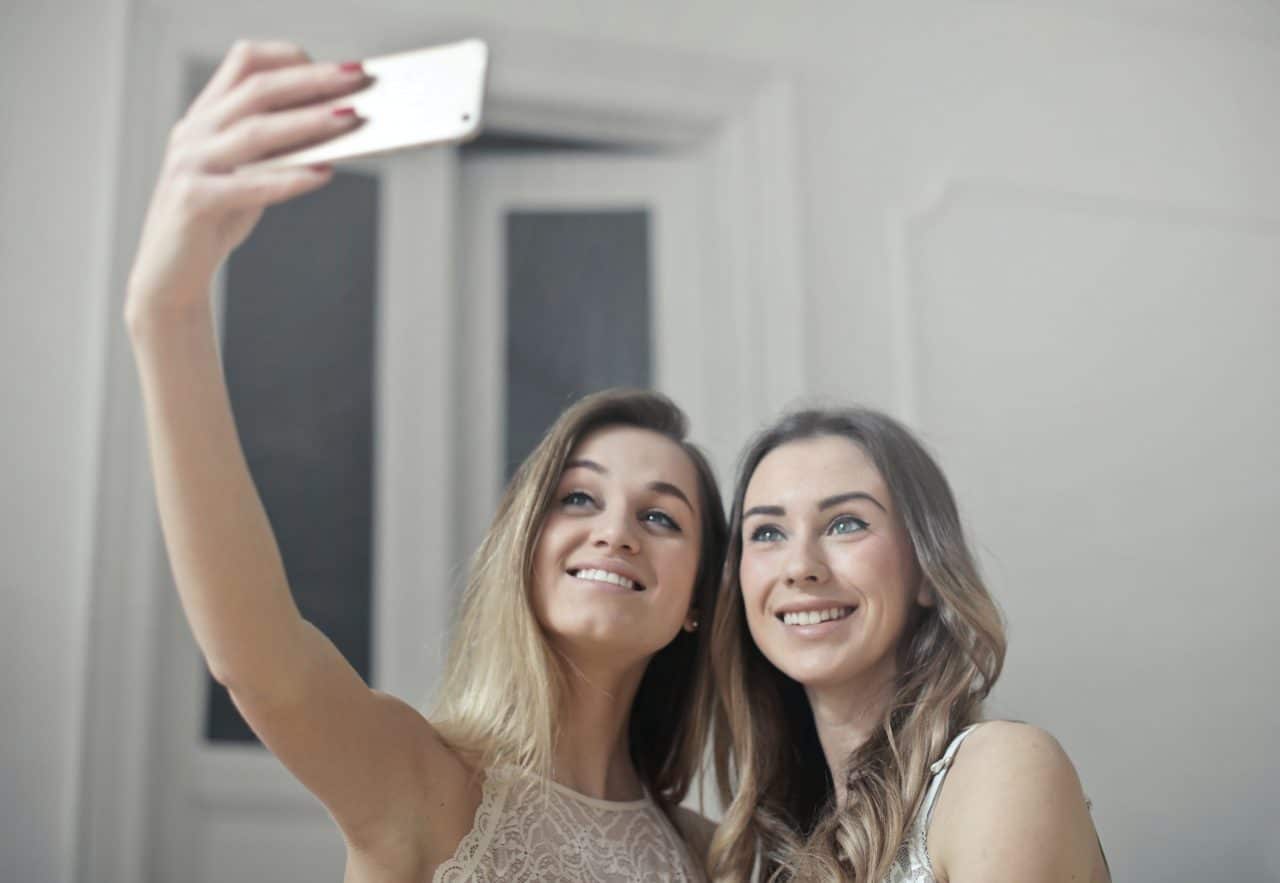 Two young women taking a selfie 