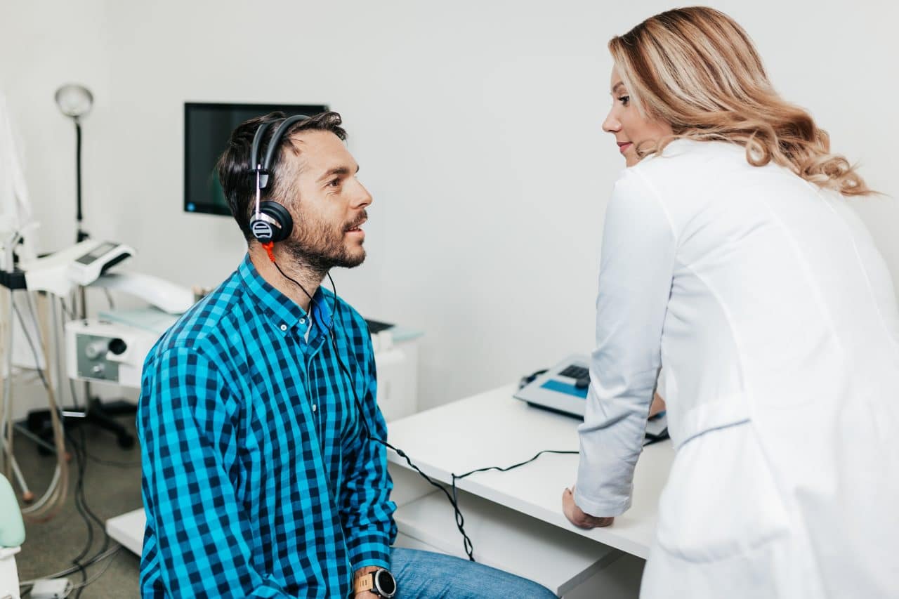 Middle-aged man getting a hearing test.