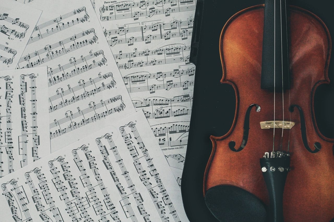 Music pages and violin.
