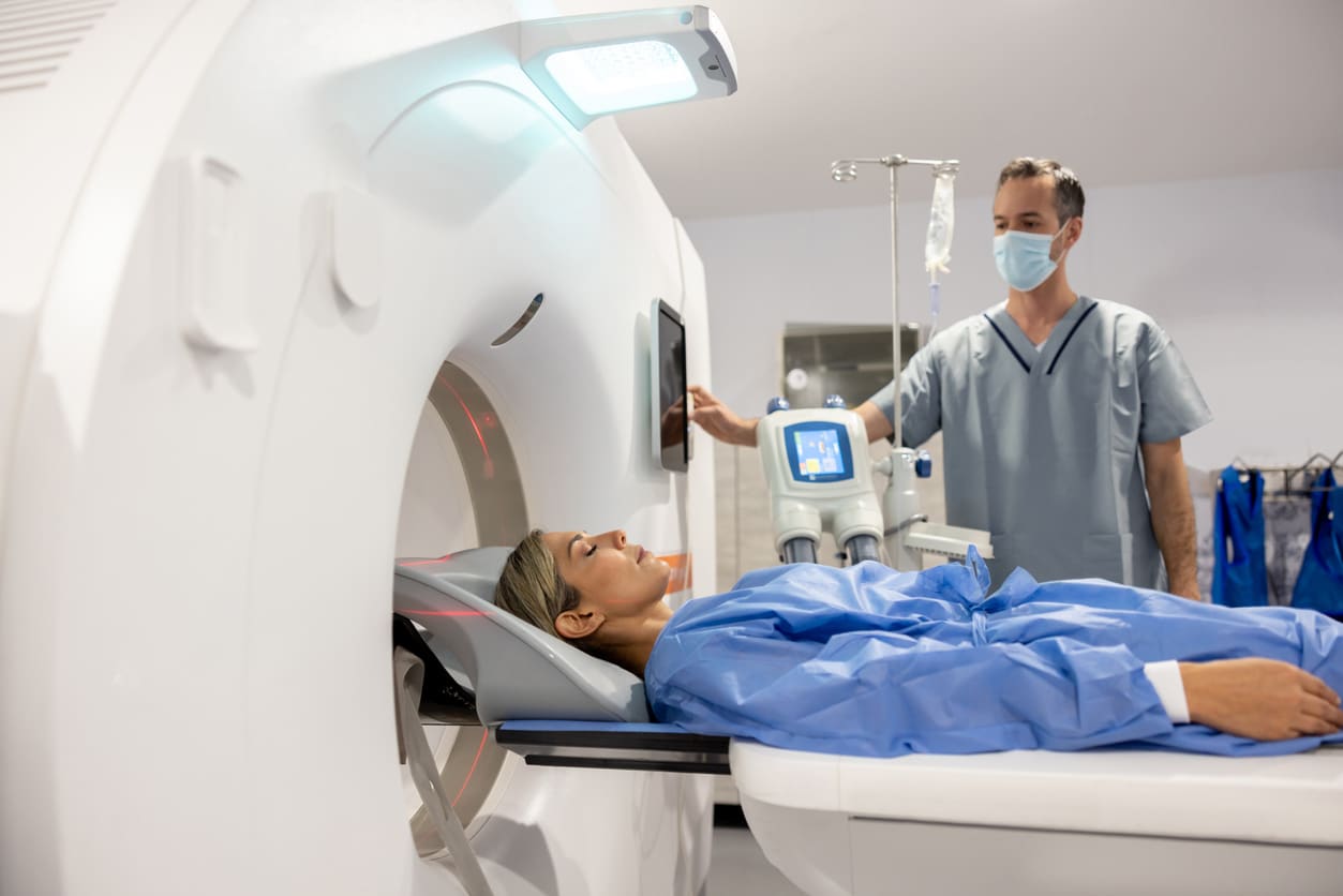 Woman getting a CT scan for an otosclerosis diagnosis.