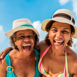 Happy smiling women with sun hats