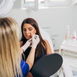 Woman doing a rhinoplasty consultation